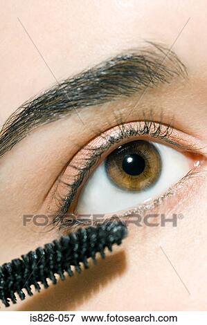 Applying mascara View Large Photo Image Stock Photo - Applying mascara. Fotosearch