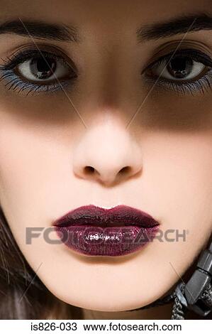 Stock Image - Face of a woman in shadow. Fotosearch