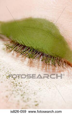 Stock Photo - Green eyeshadow on eyelid. Fotosearch