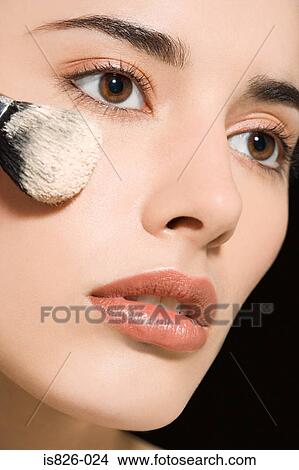 Woman applying face powder View Large Photo Image Picture - Woman applying face powder. Fotosearch