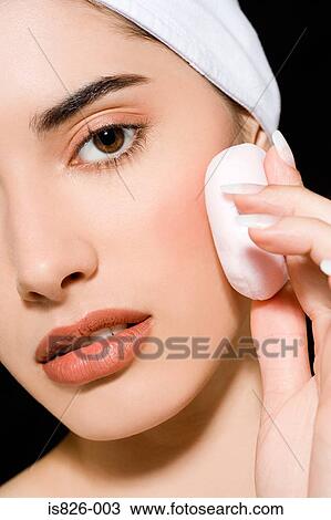 Woman applying makeup View Large Photo Image Stock Image - Woman applying makeup. Fotosearch