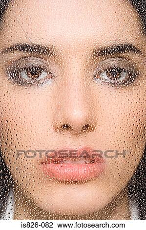 Woman behind water droplets on glass View Large Photo Image Stock Image - Woman behind water droplets on glass. Fotosearch