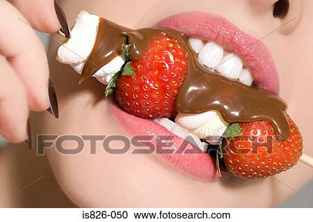Woman biting sweet kebab View Large Photo Image Stock Image - Woman biting sweet kebab. Fotosearch