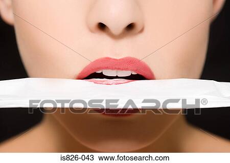 Woman blotting her lipstick View Large Photo Image Stock Image - Woman blotting her lipstick. Fotosearch