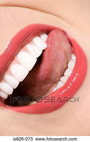 Woman licking her lips View Large Photo Image Stock Image - Woman licking her lips. Fotosearch