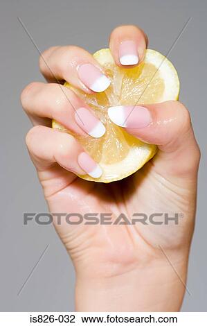 Woman squeezing a lemon View Large Photo Image Stock Image - Woman squeezing a lemon. Fotosearch