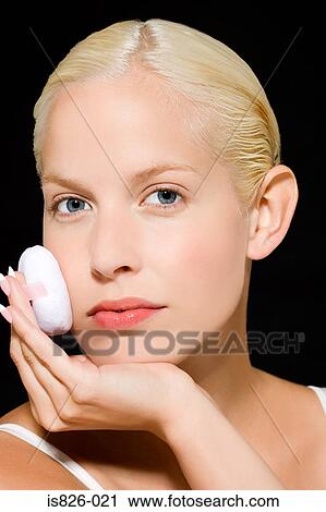 Woman using powder puff View Large Photo Image Stock Image - Woman using powder puff. Fotosearch