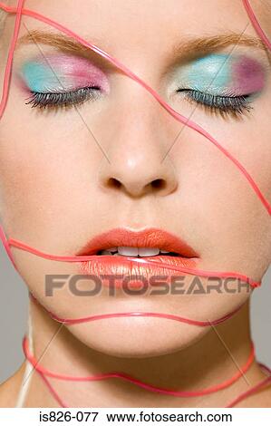 Woman with cables across her face View Large Photo Image Stock Photo - Woman with cables across her face. Fotosearch