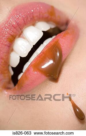 Woman with chocolate sauce on her lips View Large Photo Image Stock Image - Woman with chocolate sauce on her lips. Fotosearch