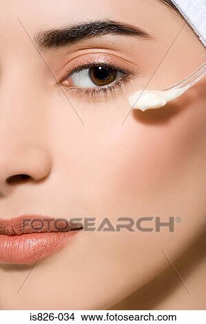 Woman with cosmetic cream View Large Photo Image Picture - Woman with cosmetic cream. Fotosearch