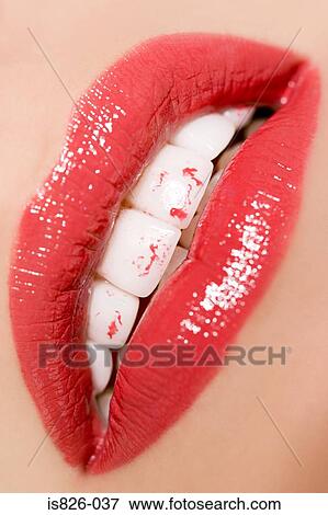 Woman with lipstick on her teeth View Large Photo Image Stock Photo - Woman with lipstick on her teeth. Fotosearch