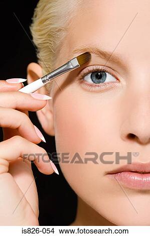 Woman with makeup brush View Large Photo Image Picture - Woman with makeup brush. Fotosearch