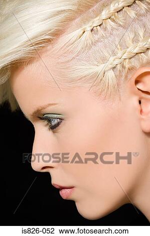 Stock Image - Woman with plaits in her hair. Fotosearch