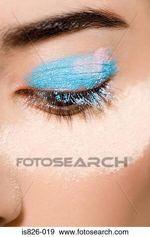 Woman with powder around her eye View Large Photo Image Stock Photo - Woman with powder around her eye. Fotosearch
