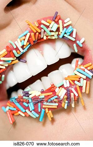 Woman with sugar sprinkles on her lips View Large Photo Image Stock Image - Woman with sugar sprinkles on her lips. Fotosearch