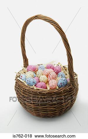 Stock Photo - Basket of easter eggs. Fotosearch