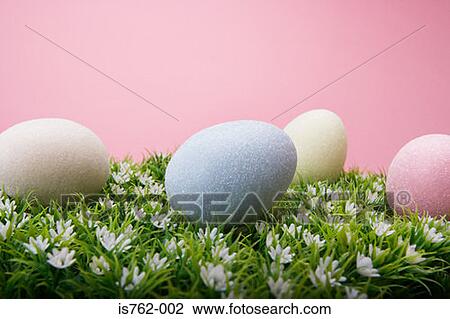 Stock Image - Easter eggs on grass. Fotosearch