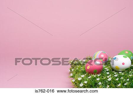 Stock Photograph - Easter eggs on grass. Fotosearch