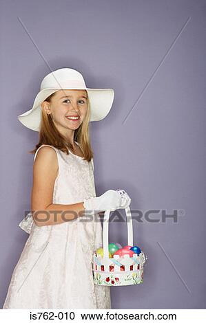 Girl holding a bunch of easter eggs View Large Photo Image Stock Image - Girl holding a bunch of easter eggs. Fotosearch