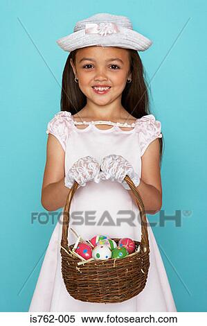 Girl holding a bunch of easter eggs View Large Photo Image Stock Photography - Girl holding a bunch of easter eggs. Fotosearch