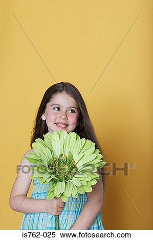 Girl holding a large green flower View Large Photo Image Stock Photography - Girl holding a large green flower. Fotosearch