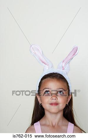 Girl wearing rabbit ears View Large Photo Image Stock Photography - Girl wearing rabbit ears. Fotosearch