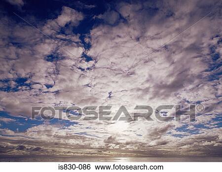 Stock Photograph - Cloudscape over the sea. Fotosearch