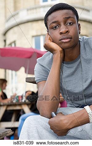Stock Photo - Boy looking sullen. Fotosearch