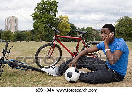 Boy on cellphone View Large Photo Image Picture - Boy on cellphone. Fotosearch