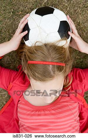 Girl leaning on football View Large Photo Image Stock Photograph - Girl leaning on football. Fotosearch