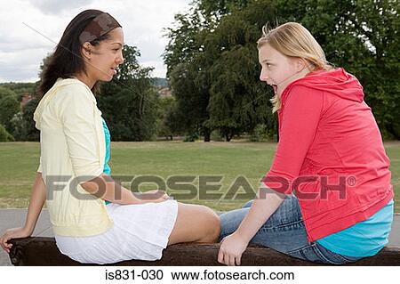 Girls gossiping View Large Photo Image Stock Image - Girls gossiping. Fotosearch