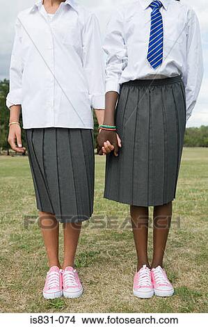 Picture - Schoolgirls holding hands. Fotosearch
