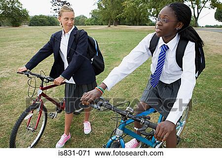 Schoolgirls with bicycles View Large Photo Image Stock Image - Schoolgirls with bicycles. Fotosearch