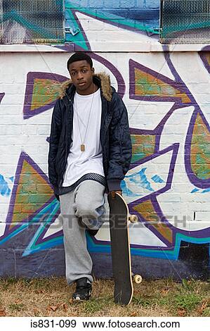 Teenage boy with skateboard View Large Photo Image Stock Photo - Teenage boy with skateboard. Fotosearch