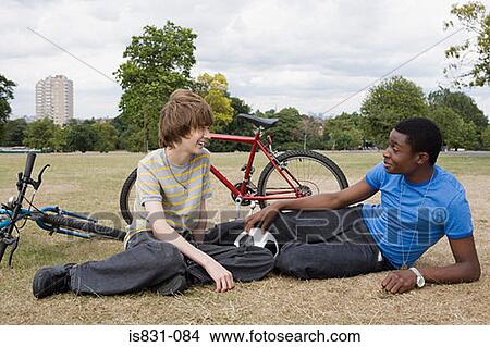 Picture - Teenage boys in the park. Fotosearch