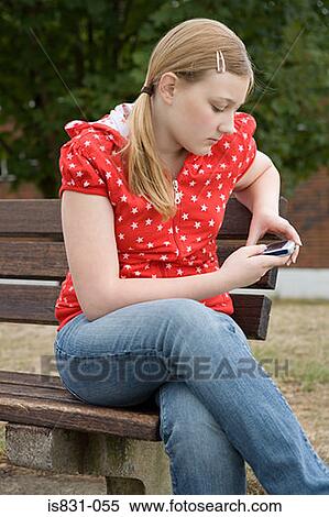 Teenage girl with cellphone View Large Photo Image Stock Photography - Teenage girl with cellphone. Fotosearch