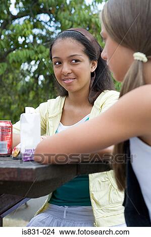 Teenage girls at picnic table View Large Photo Image Picture - Teenage girls at picnic table. Fotosearch
