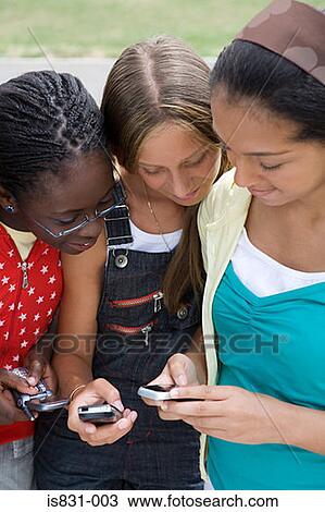 Teenage girls with cellphones View Large Photo Image Stock Image - Teenage girls with cellphones. Fotosearch