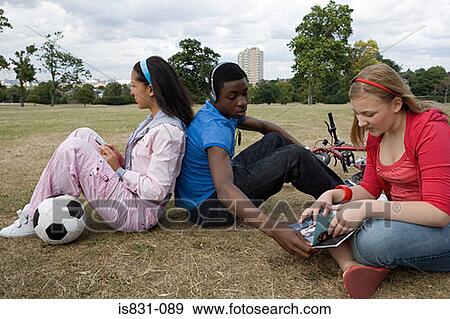 Teenagers in the park View Large Photo Image Stock Photo - Teenagers in the park. Fotosearch