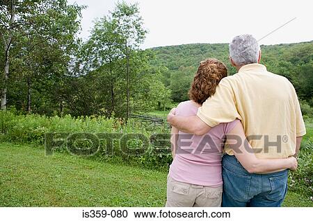 Mature couple looking at view View Large Photo Image Stock Image - Mature couple looking at view. Fotosearch