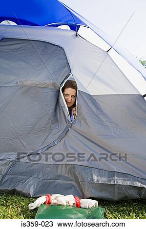 Mature woman peering from tent View Large Photo Image Stock Image - Mature woman peering from tent. Fotosearch