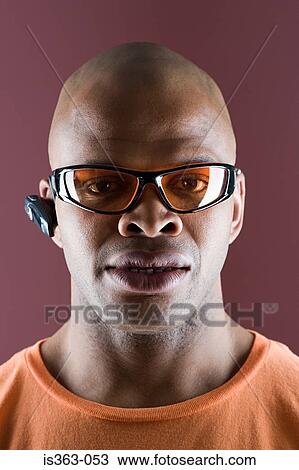 Man wearing sunglasses and headset View Large Photo Image Stock Image - Man wearing sunglasses and headset. Fotosearch