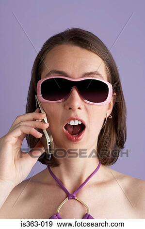 Shocked woman on cellphone View Large Photo Image Stock Photo - Shocked woman on cellphone. Fotosearch