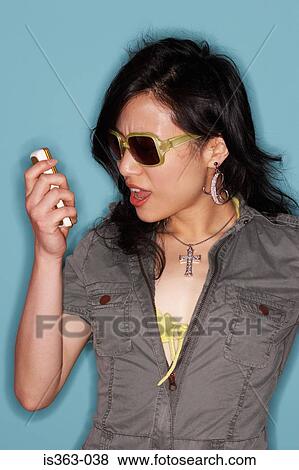 Stock Photo - Woman shouting at cellphone. Fotosearch