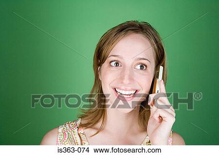 Young woman on cellphone View Large Photo Image Picture - Young woman on cellphone. Fotosearch
