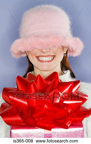 Fluffy hat covering womans face View Large Photo Image Stock Photo - Fluffy hat covering womans face. Fotosearch
