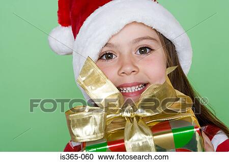 Girl holding present View Large Photo Image Stock Image - Girl holding present. Fotosearch