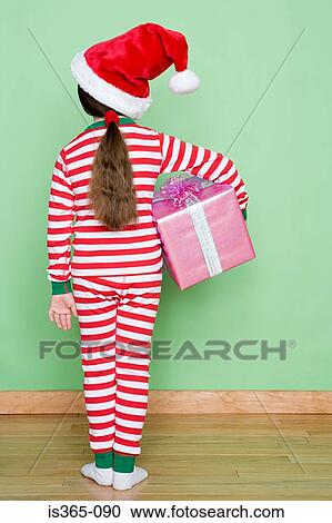 Stock Image - Girl holding present. Fotosearch