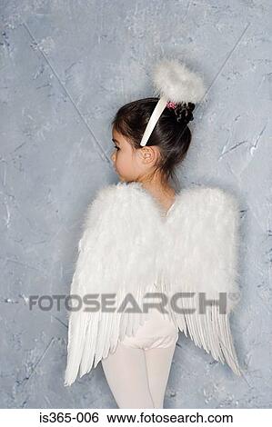Girl in an angel costume View Large Photo Image Stock Photograph - Girl in an angel costume. Fotosearch