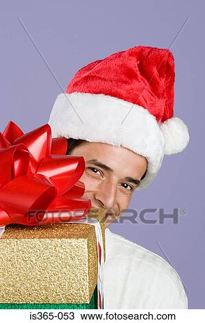 Man holding presents View Large Photo Image Stock Image - Man holding presents. Fotosearch